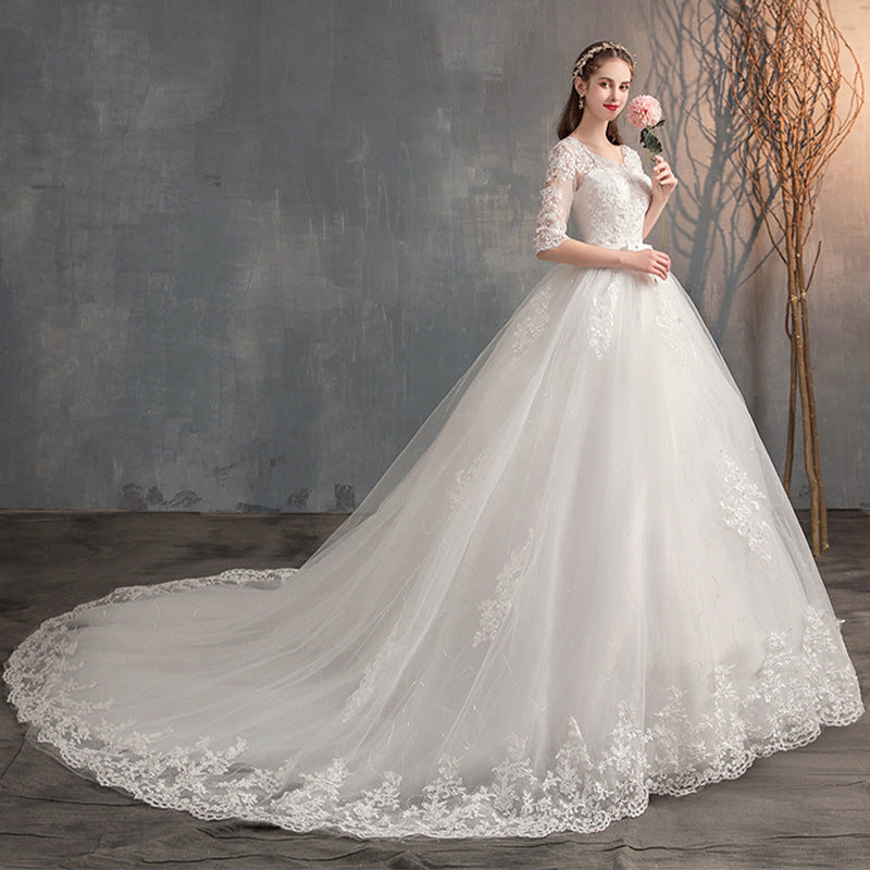 Illusion Lace Back Wedding Dress – Long Bell Sleeve Bridal Gown. luxury bridal gown by Bridal Boutique