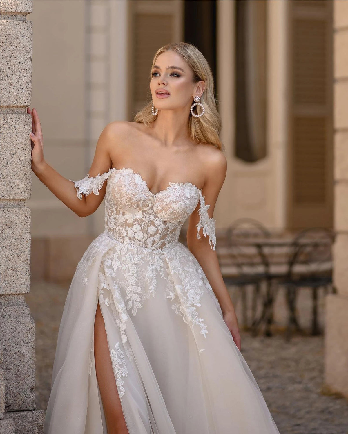 Romantic Off – the – Shoulder Tulle A – Line Wedding Dress with High Slit. luxury bridal gown by Bridal Boutique
