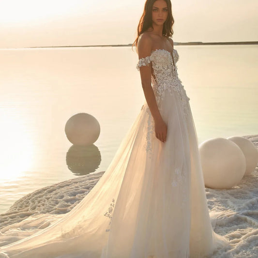 Boho Off-the-Shoulder Tulle Wedding Dress with Detachable Puff Sleeves.