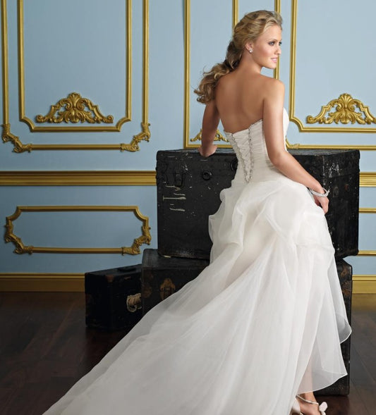 Strapless High-Low Wedding Dress with Dramatic Ruffled Train.