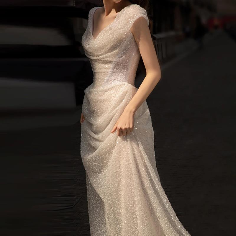 Romantic Off-the-Shoulder Lace Sheath Wedding Dress with Draped Sleeves.