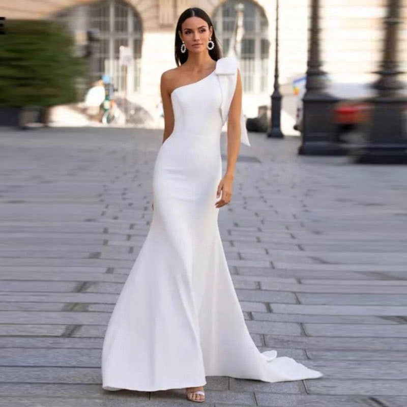 Modern One-Shoulder Mermaid Wedding Dress with Statement Statement Bow.