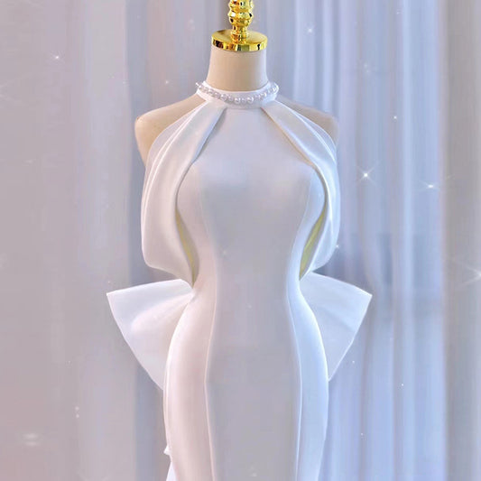 Modern Halter Satin Mermaid Wedding Dress with Dramatic Back Bow.