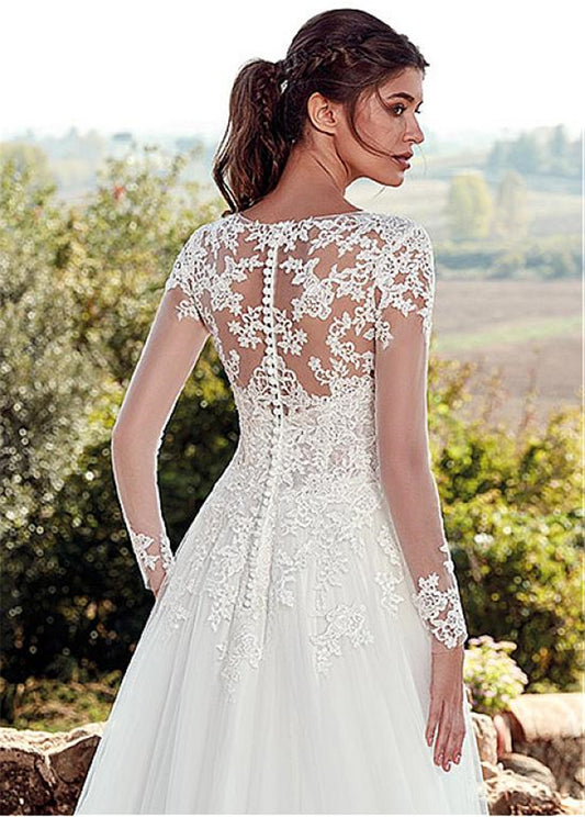 Elegant Illusion Long Sleeve Lace Wedding Dress with Cathedral Train.