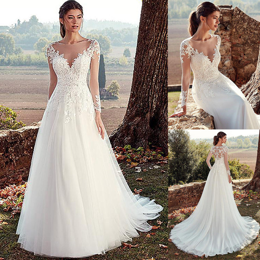 Illusion Long Sleeve Lace Wedding Dress with Cathedral Train. luxury bridal gown by Bridal Boutique