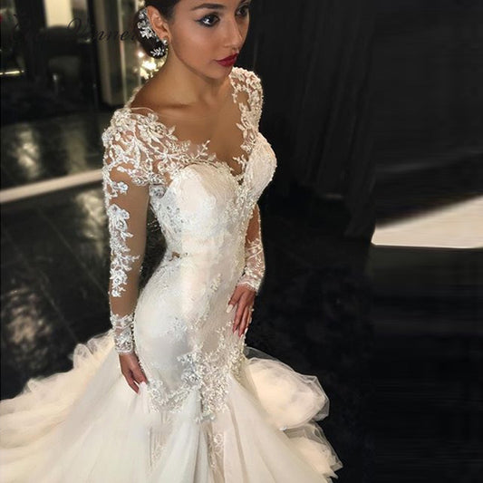 Long Sleeve Lace Mermaid Wedding Dress with Dramatic Cathedral Train.