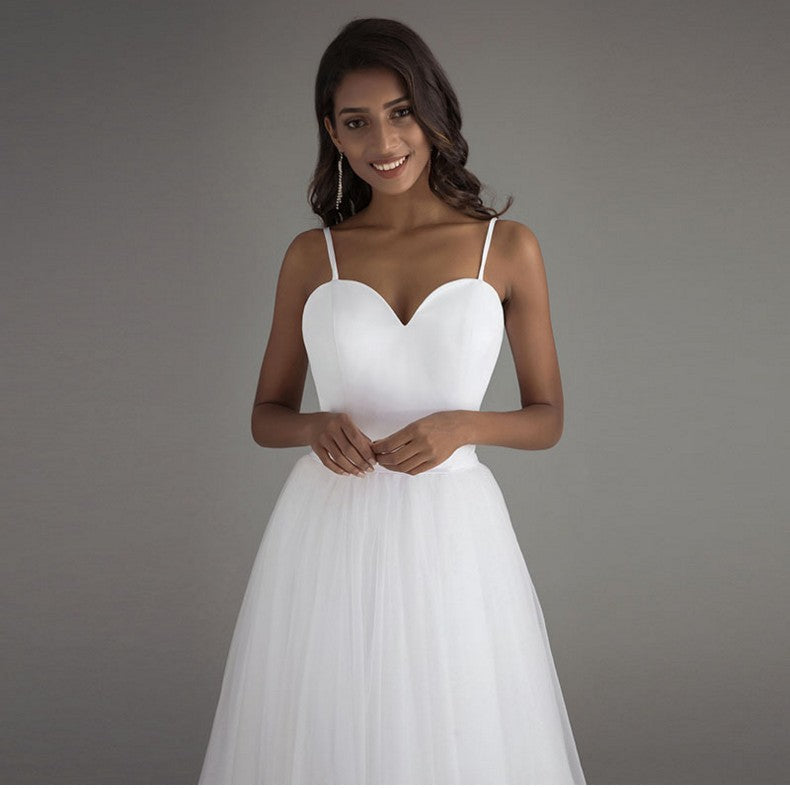 Simple Sweetheart Tulle A-Line Wedding Dress with High-Low Train.