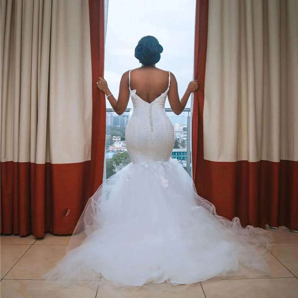 Luxury Beaded Lace Mermaid Wedding Dress with Dramatic Tulle Train.