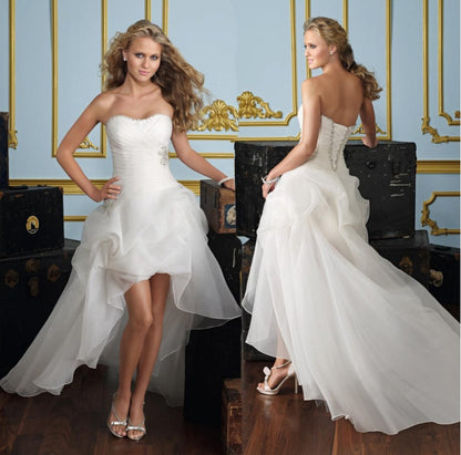 Strapless High-Low Wedding Dress with Dramatic Ruffled Train.