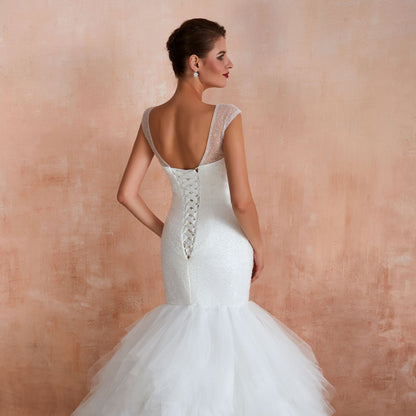 Dramatic Mermaid Wedding Dress with Ruffled Tulle Skirt & Corset Back.