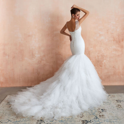 Dramatic Mermaid Wedding Dress with Ruffled Tulle Skirt & Corset Back.