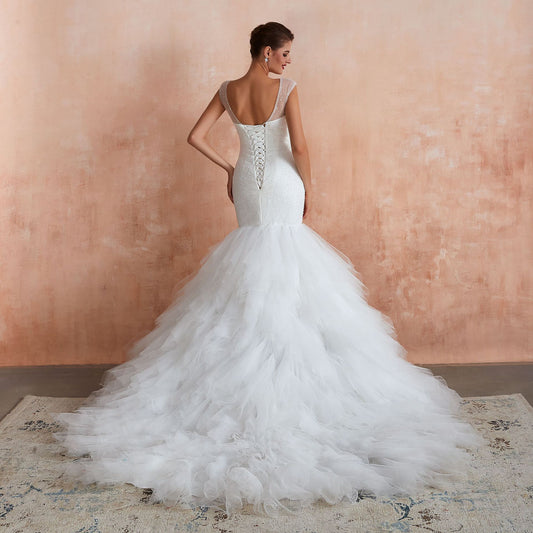Dramatic Mermaid Wedding Dress with Ruffled Tulle Skirt & Corset Back.
