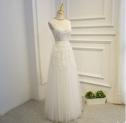 Sleeveless White Evening Gown - Fitted High-Neck Wedding Dress with Lace Detail