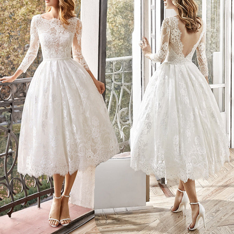 Vintage 1950s Long Sleeve Lace Tea-Length Wedding Dress with Low V-Back.
