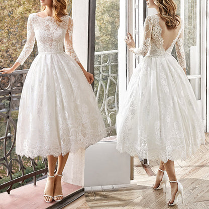 Vintage 1950s Long Sleeve Lace Tea-Length Wedding Dress with Low V-Back.