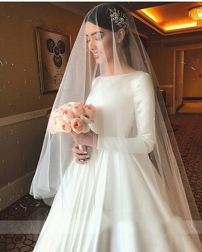 Royal Satin Long Sleeve A-Line Wedding Dress with Boat Neckline.