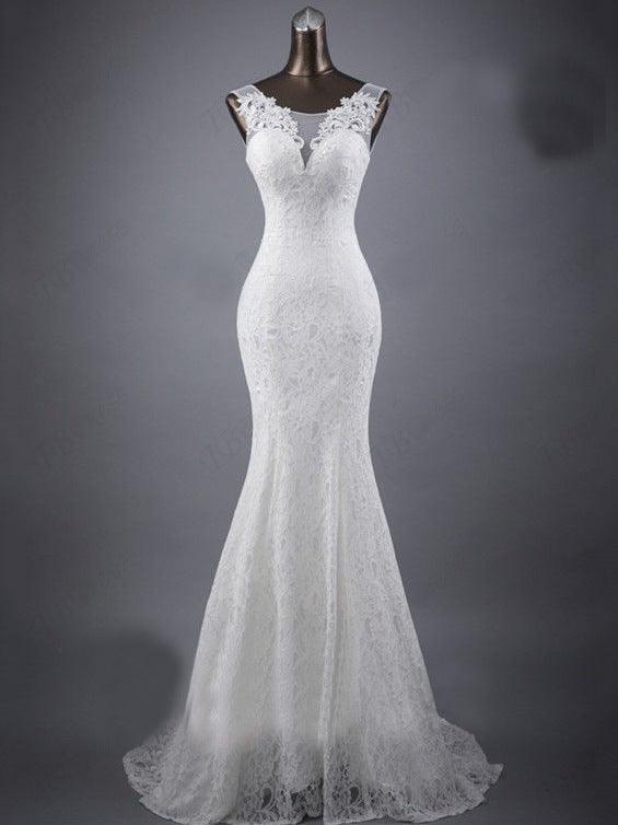 Elegant Lace Trumpet Wedding Dress with Illusion Neckline and Train.