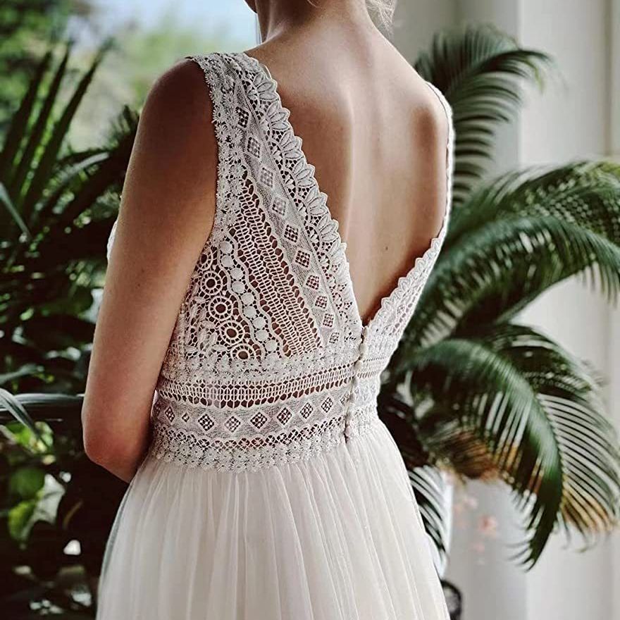 Ivory A-Line Chiffon Wedding Dress with V-Neck and Long Sleeves.