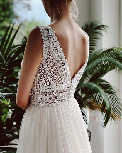 Ivory A-Line Chiffon Wedding Dress with V-Neck and Long Sleeves.