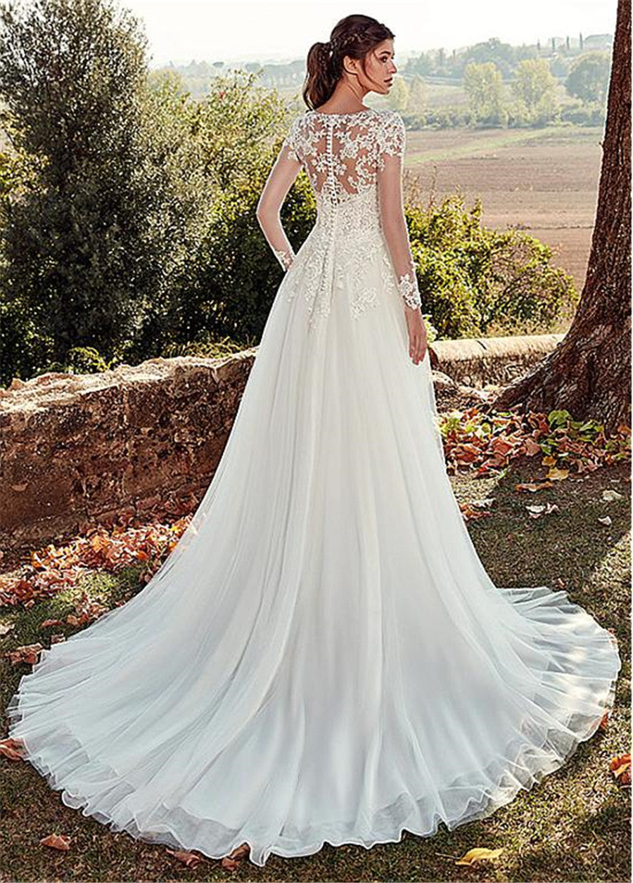 Elegant Illusion Long Sleeve Lace Wedding Dress with Cathedral Train.