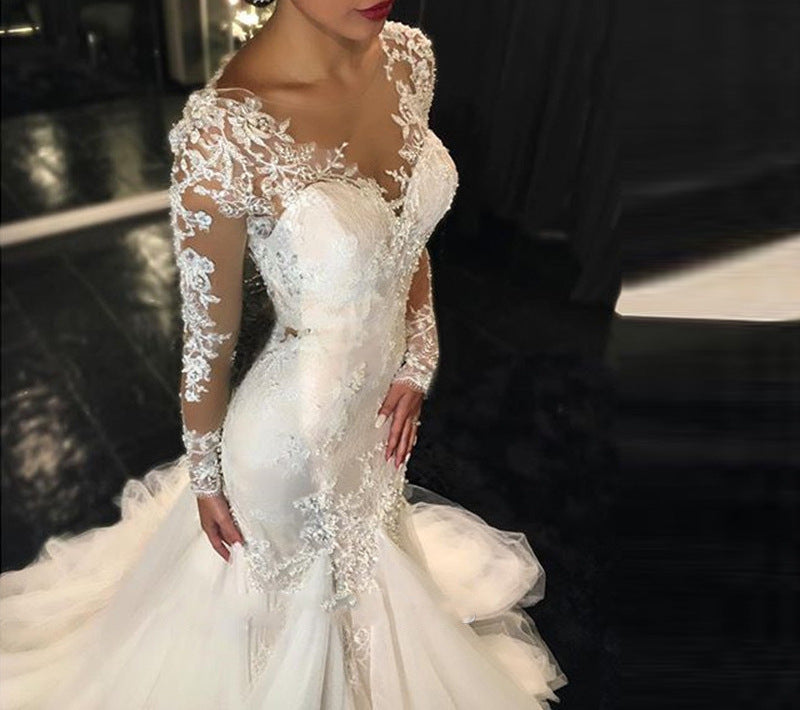 Long Sleeve Lace Mermaid Wedding Dress with Dramatic Cathedral Train.