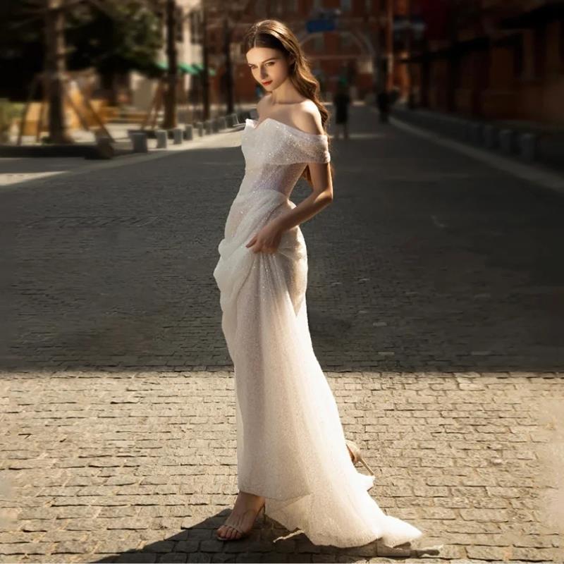Romantic Off-the-Shoulder Lace Sheath Wedding Dress with Draped Sleeves.