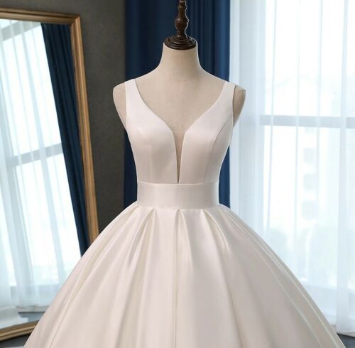 Classic Satin Ball Gown Wedding Dress with Plunging V-Neckline.