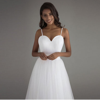 Simple Sweetheart Tulle A-Line Wedding Dress with High-Low Train.
