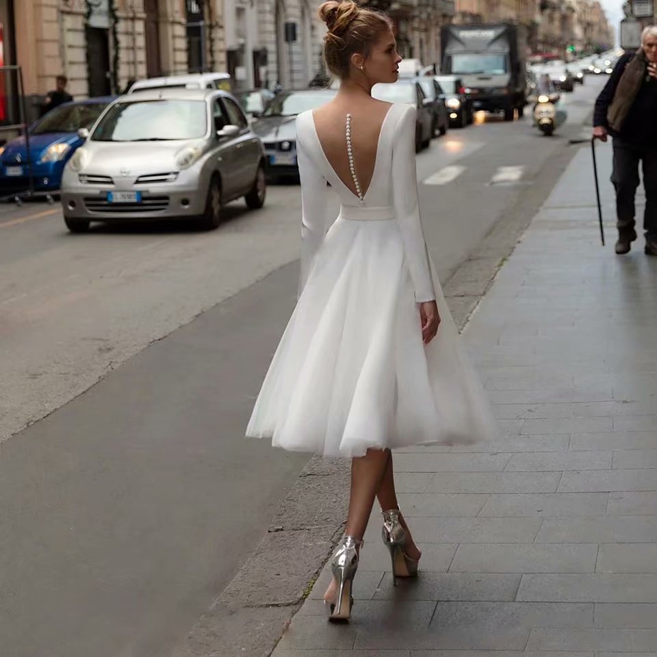 Boho Off-the-Shoulder Long Sleeve Tulle Wedding Dress with Lace Bodice.