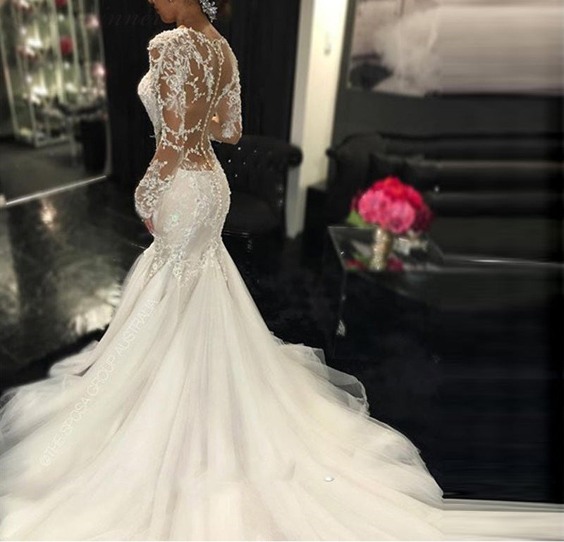 Long Sleeve Lace Mermaid Wedding Dress with Dramatic Cathedral Train.