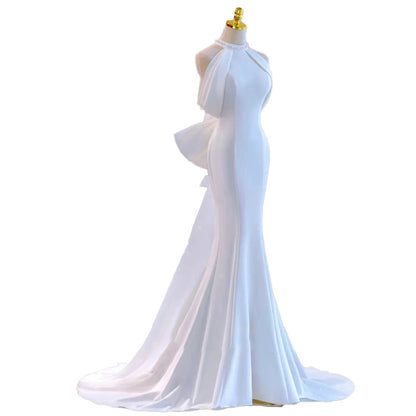 Modern Halter Satin Mermaid Wedding Dress with Dramatic Back Bow.