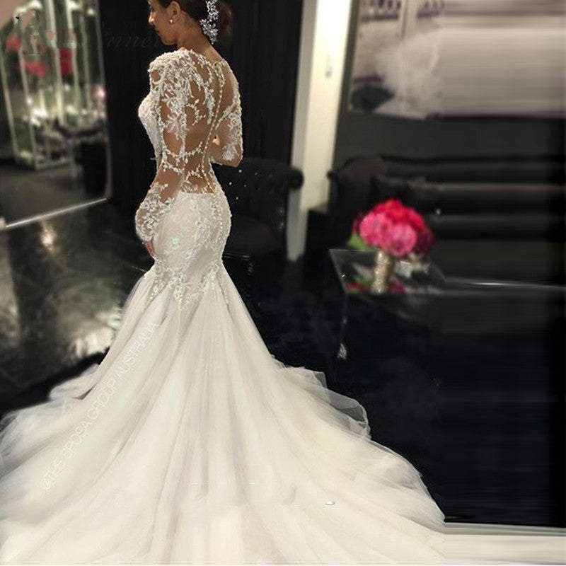 Long Sleeve Lace Mermaid Wedding Dress with Dramatic Cathedral Train.