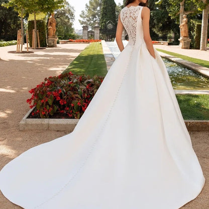 Elegant Satin A-Line Wedding Dress with Dramatic Illusion Lace Back.