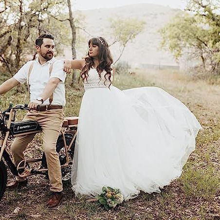 Ivory A-Line Chiffon Wedding Dress with V-Neck and Long Sleeves.