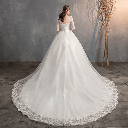 Romantic Floral Lace Appliqué A-Line Wedding Dress with Tulle Skirt.