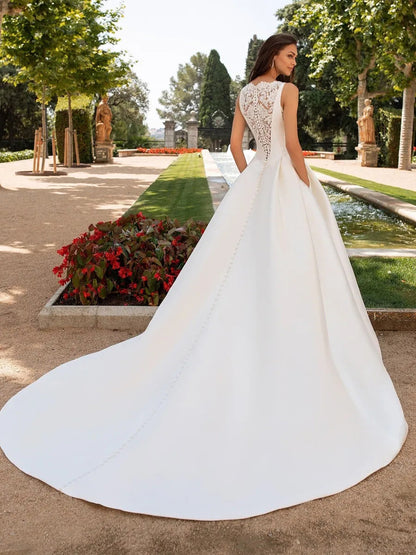 Elegant Satin A-Line Wedding Dress with Dramatic Illusion Lace Back.