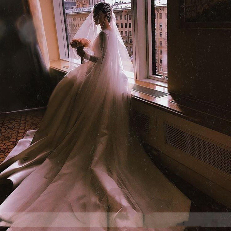 Royal Satin Long Sleeve A-Line Wedding Dress with Boat Neckline.