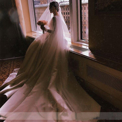 Royal Satin Long Sleeve A-Line Wedding Dress with Boat Neckline.