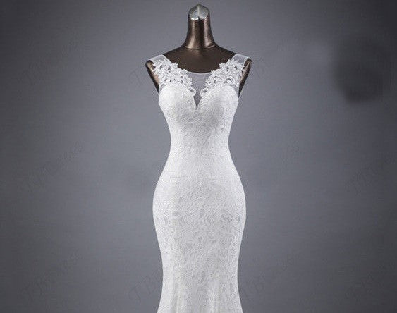 Elegant Lace Trumpet Wedding Dress with Illusion Neckline and Train.