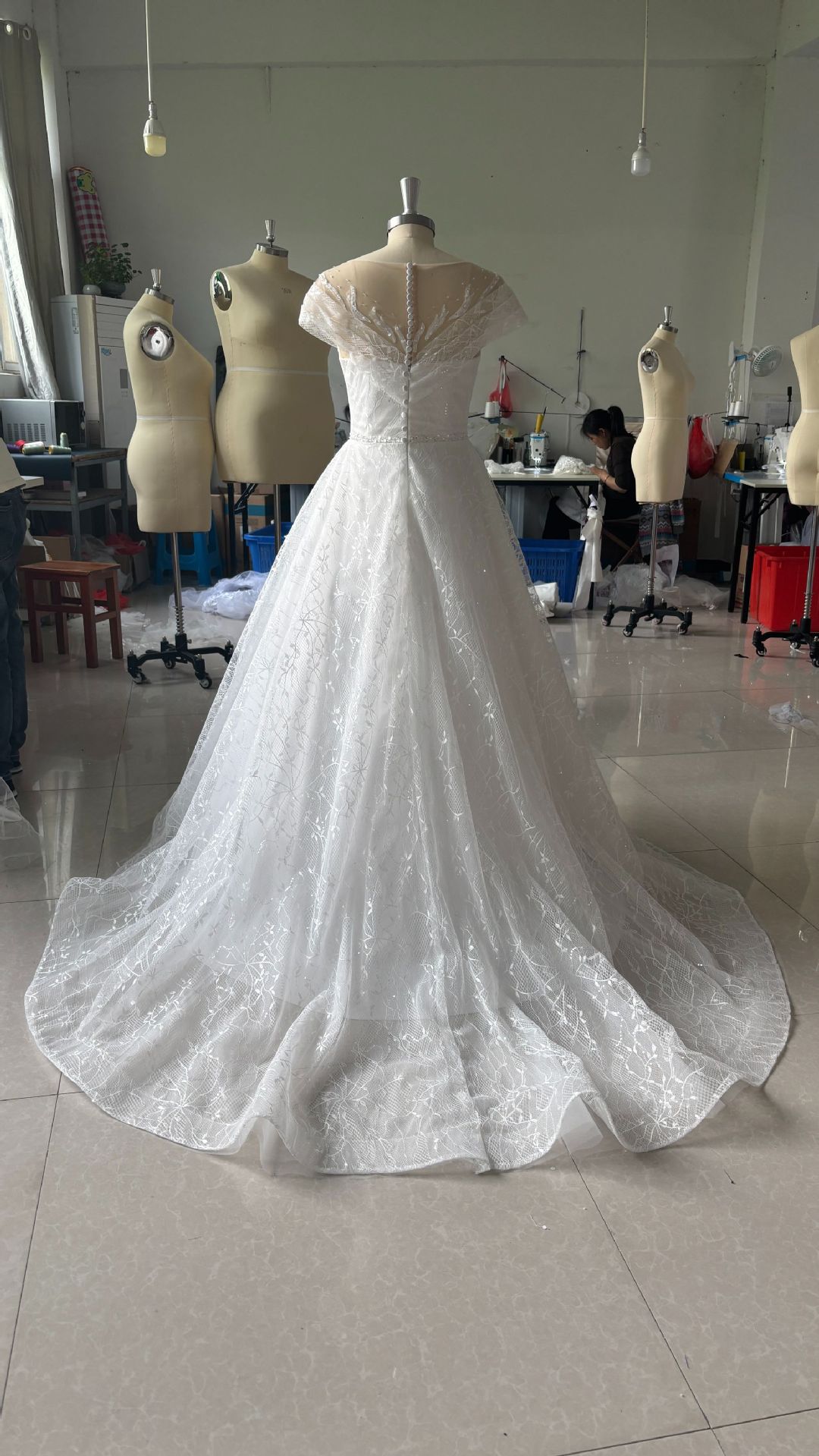 Off-Shoulder White Lace Wedding Dress with Train and Veil.