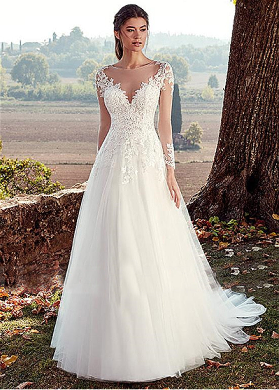 Elegant Illusion Long Sleeve Lace Wedding Dress with Cathedral Train.