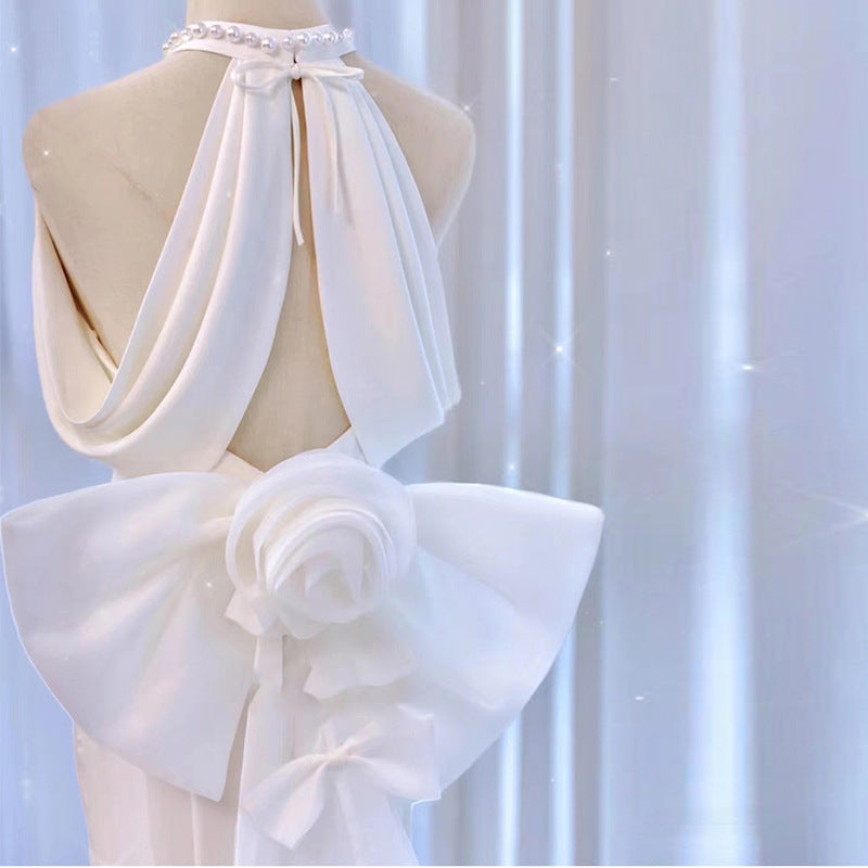 Modern Halter Satin Mermaid Wedding Dress with Dramatic Back Bow.