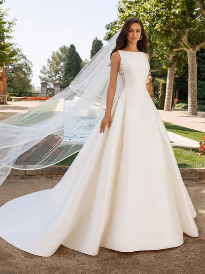 Elegant Satin A-Line Wedding Dress with Dramatic Illusion Lace Back.