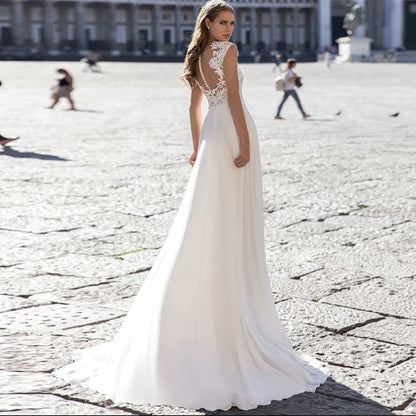 Ivory A-Line Chiffon Wedding Dress with V-Neck and Long Sleeves.