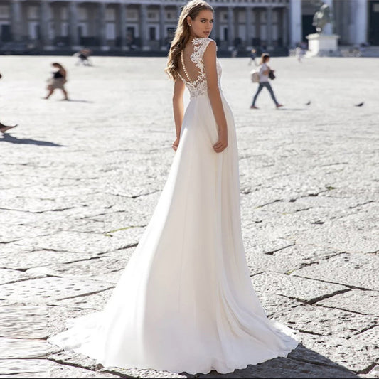 Ivory A-Line Chiffon Wedding Dress with V-Neck and Long Sleeves.