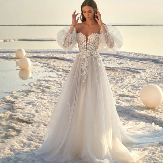 Boho Off-the-Shoulder Tulle Wedding Dress with Detachable Puff Sleeves.