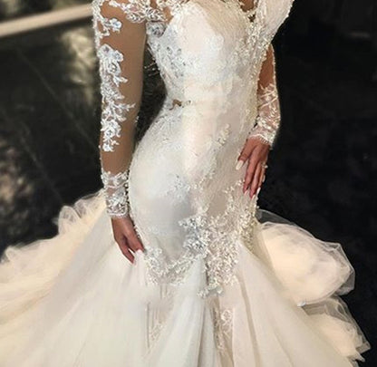 Long Sleeve Lace Mermaid Wedding Dress with Dramatic Cathedral Train.