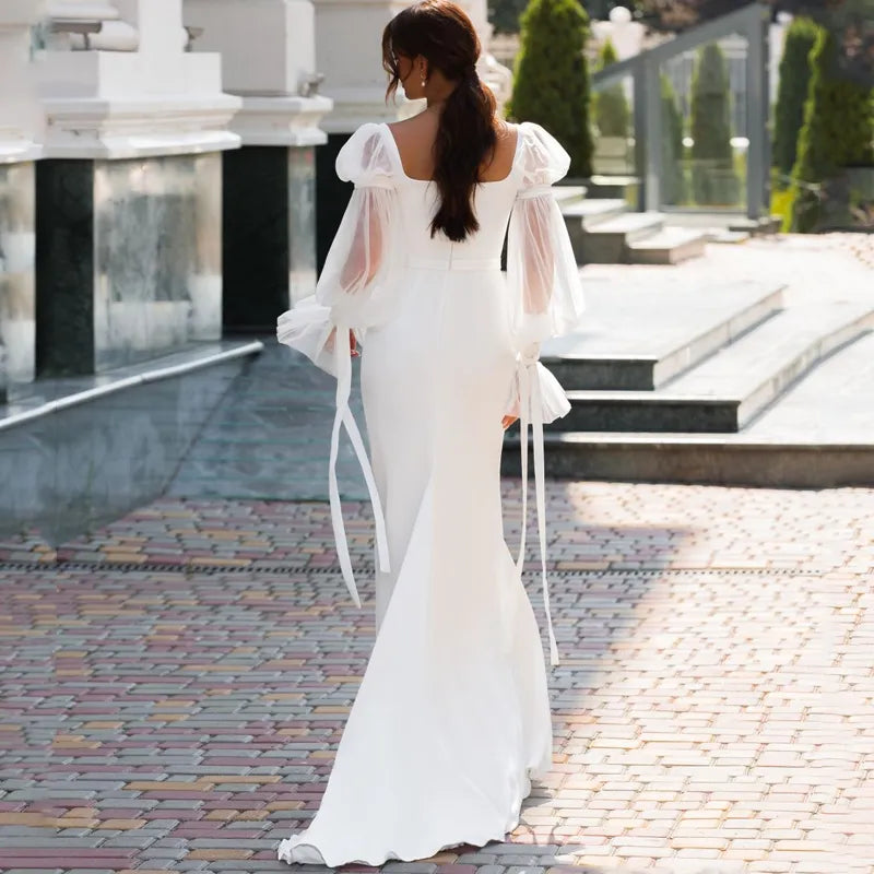 Elegant Off-the-Shoulder Lace Long Sleeve Mermaid Wedding Dress.
