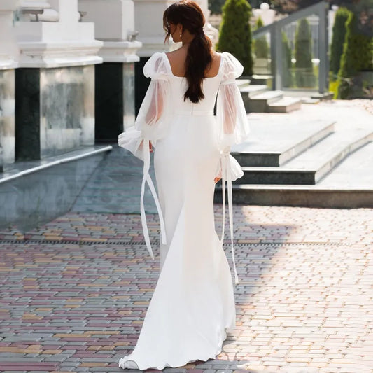 Elegant Off-the-Shoulder Lace Long Sleeve Mermaid Wedding Dress.