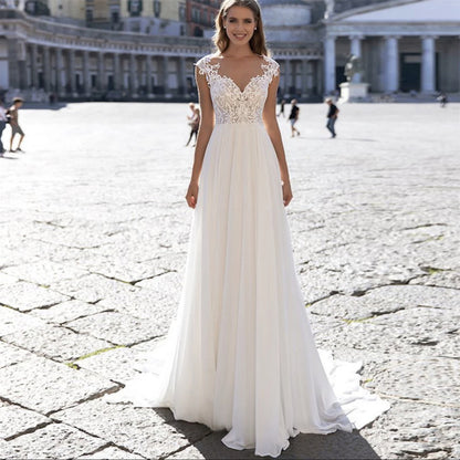 Ivory A-Line Chiffon Wedding Dress with V-Neck and Long Sleeves.